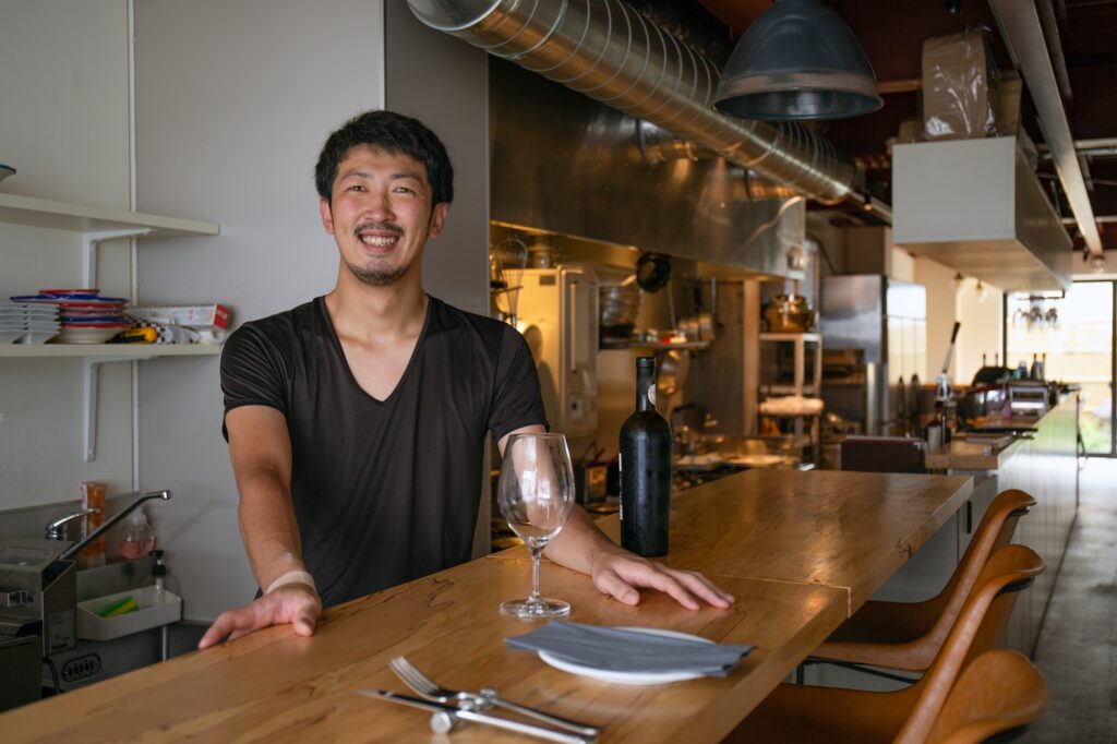 A man, owner and manager of a small restaurant