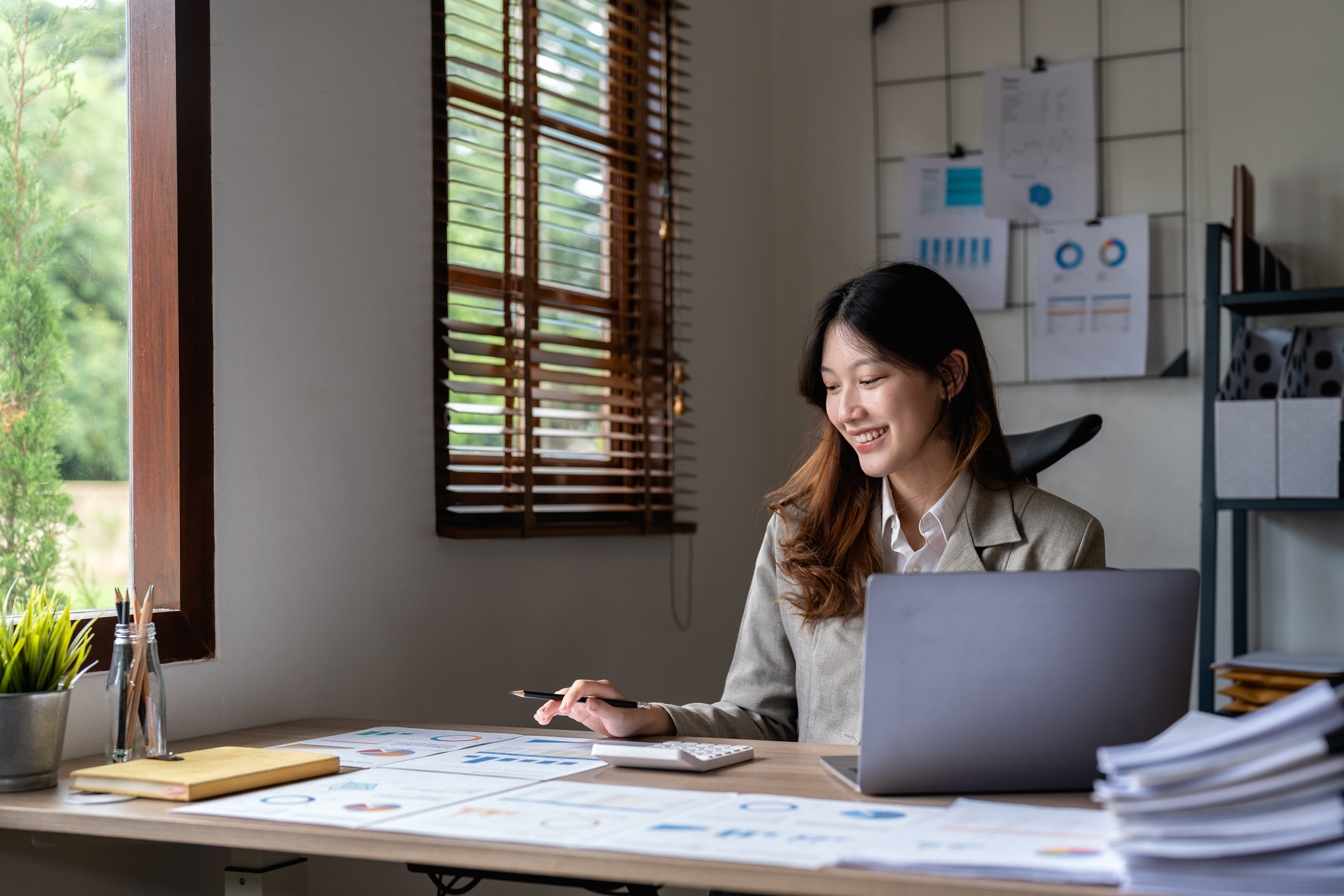 Portrait asian woman accountant working with computer and calculator for business and financial