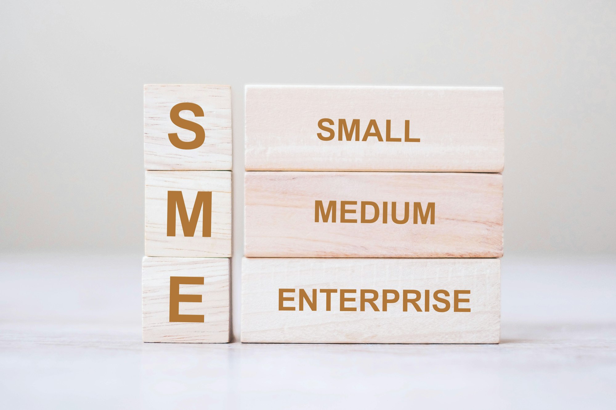 SME text (Small Medium Enterprise) wooden cube blocks